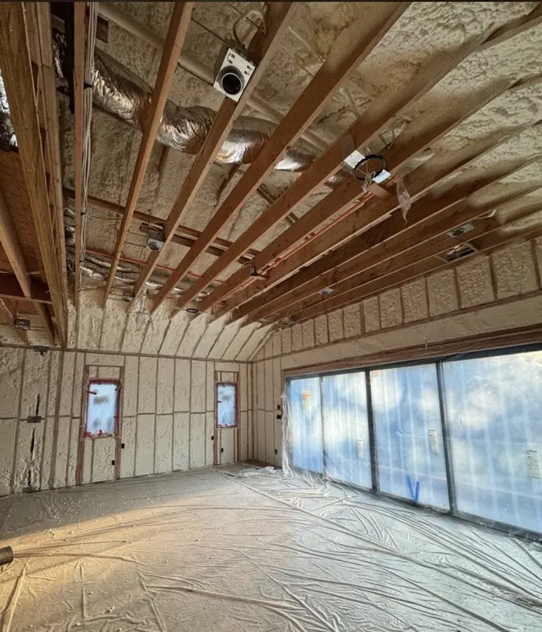 Interior walls and ceiling insulated with spray foam during new construction in Victoria